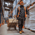 Warehouse operative transporting goods with Hand Truck Sack Barrow